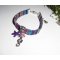 Bracciale in tessuto colorato con nappe a forma di cavalluccio marino e stella marina viola